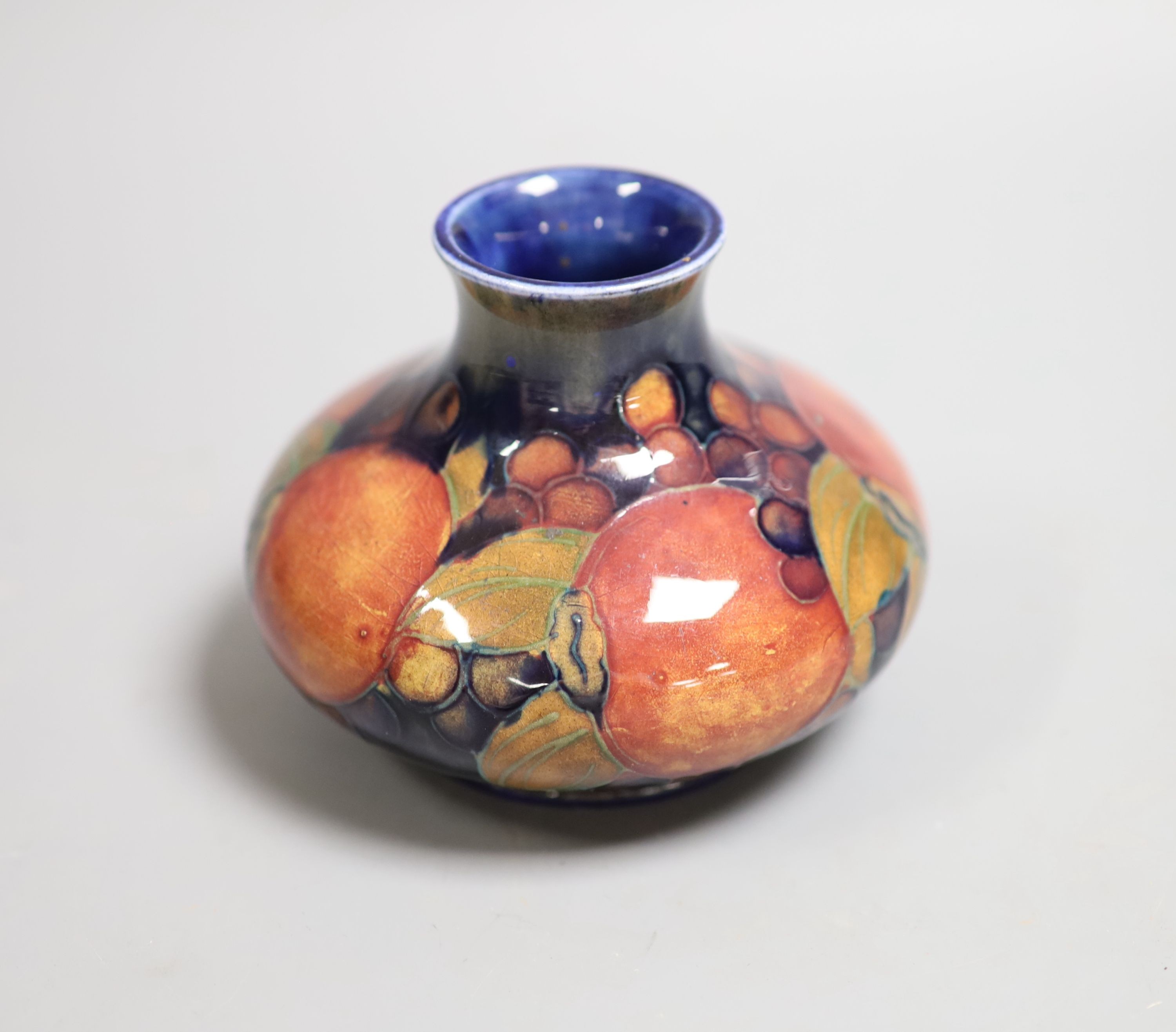 A Moorcroft Pomegranate squat baluster vase, 9cm high